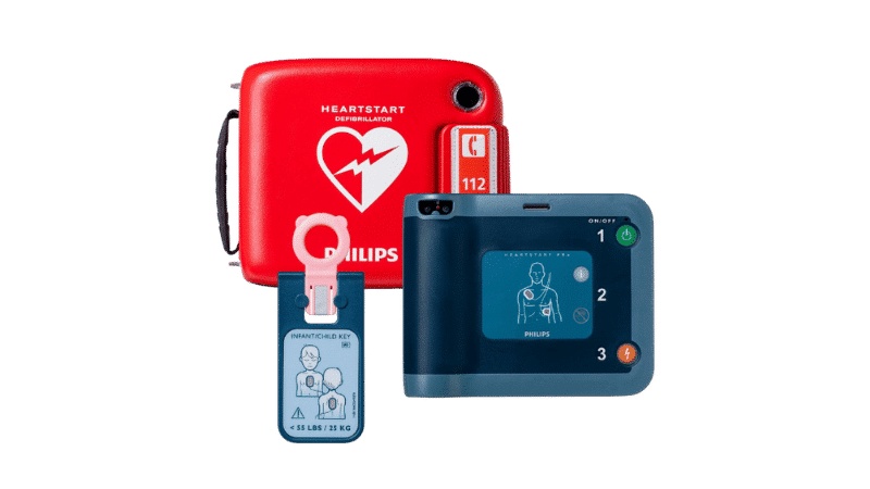 Philips HeartStart FR3 AED met rode draagtas en kind-/baby-sleutel.